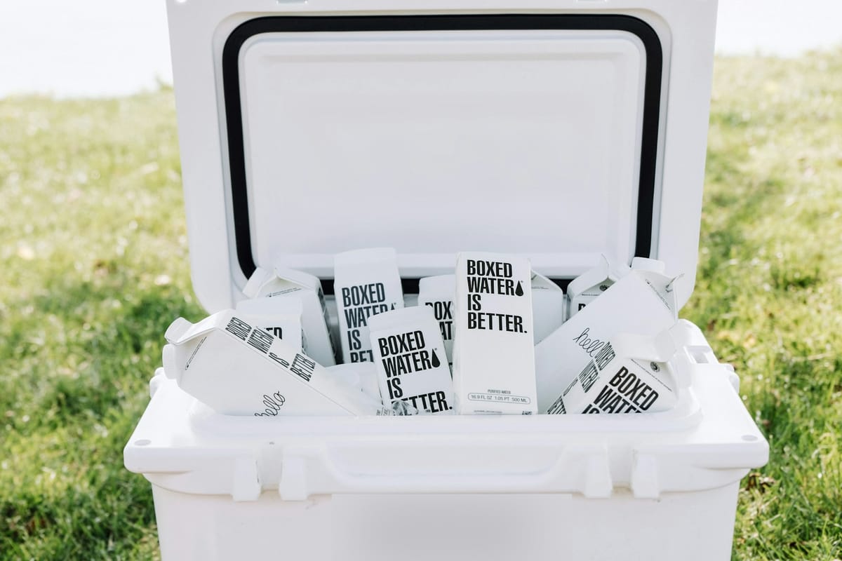 Open cooler box filled with ice on grass